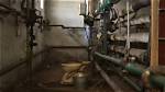 The Weird Story Behind Solitary Toilets Found in the Middle of Basements
